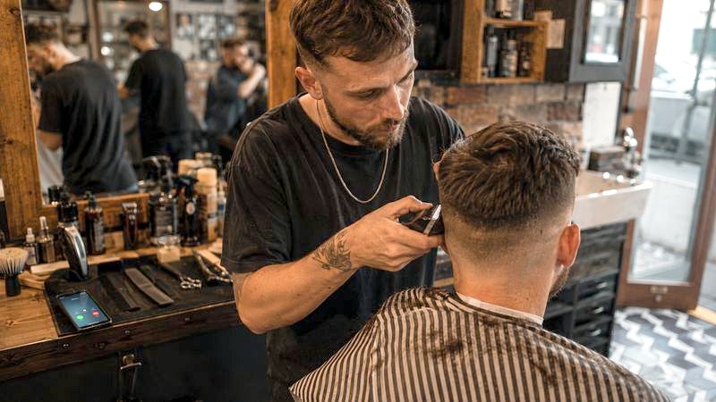 Barbers: at work, unable to reach a ringing phone.